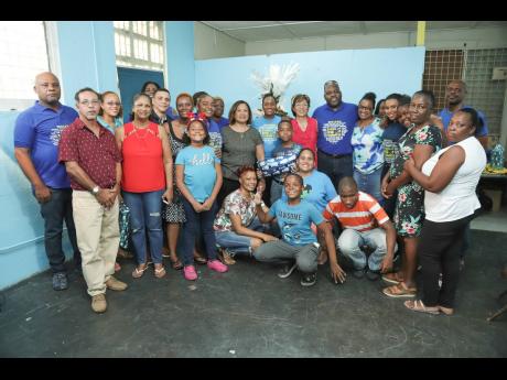 It was all smiles of gratitude! NCB’s Gratitude Bus made a stop at the Jamaica Autism Support Association’s headquarters in Kingston to reveal that they were the top voted special needs/disability organisation, as part of the foundation’s Grant a Wish Christmas programme copping an award of $1 million. The members were also gifted with a Christmas tree which was set-up and decorated by everyone with carols reverberating  in the background and a wide array of presents for the children