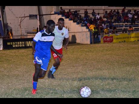 Brown’s Town FC’s Romario Ward (left) dribbles away from Central Kingston FC’s captain Donovan Alvaranga during their first-round Magnum/KSAFA Super League football match at Harbour View Stadium on Friday, February 1, 2019. 
