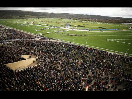 
In this Wednesday March 11, 2020 file photo, a general view from the grandstand during the Ballymore Novices’ Hurdle at the Cheltenham Racecourse, England. 