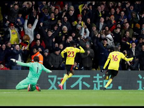 
Watford’s Ismaila Sarr (centre) celebrates after scoring his side’s second goal during the English Premier League match between Watford and Liverpool at Vicarage Road stadium in Watford, England, on Saturday, February 29, 2020. Watford won 3-0.