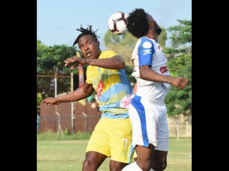 Portmore United’s Tevin Shaw (right) clashes with Waterhouse’s Stephen Williams during their Red Stripe Premier League game at the Spanish Town Prison Oval on Sunday, November 10, 2019.