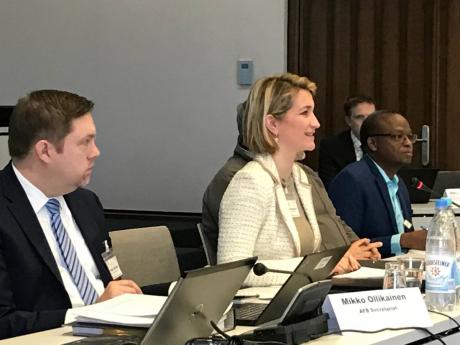 Ibila Djibril (right) at the 33rd Adaptation Fund board meeting alongside other colleagues.