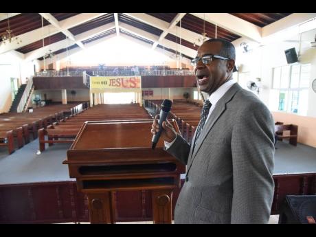 Leroy Laing, pastor of the Pentab Tabernacle in Kingston, preaching to an almost empty church on Good Friday, as only 10 members turned up in keeping with government stipulations to prevent the spread of COVID-19.  Pastor Laing says they streamed the sermon live to members who stayed at home.