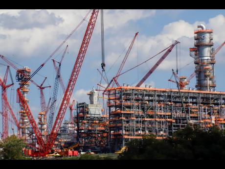 
This file photo from October 3, 2019, shows cranes as they work on construction of the Shell Pennsylvania Petrochemicals Complex and ethylene cracker plant located in Potter Township, Pennsylvania.