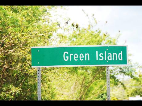 The Green Island sign stands along the North Coast Highway in Hanover.
