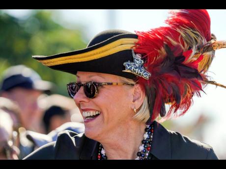 In this January 25, 2020 file photo, Tampa Mayor Jane Castor smiles while greeting people during the Gasparilla Parade of Pirates in Tampa, Florida. Castor is poking fun at last week’s attention-grabbing incident involving NFL superstar Tom Brady.