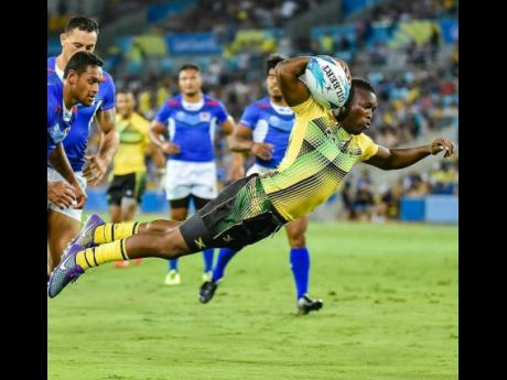 Jamaica Crocs’ Reinhardo Richards scoring his team’s lone try against Samoa in Commonwealth Games Rugby Sevens action on the Gold Coast, Australia, on Saturday, April 14, 2018.  File