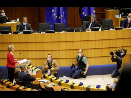 European Commission President Ursula von der Leyen (left) addresses the European Parliament plenary in Brussels on Wednesday, May 27, 2020.