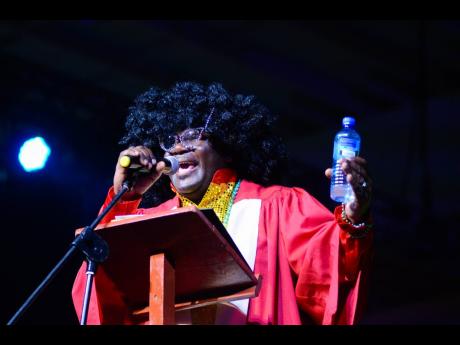 Cordel Green, executive director, Broadcasting Commission, performs a skit at the Powerful Men and Women Perform for Charity concert held at the National Indoor Sports Centre, June 10, 2018.