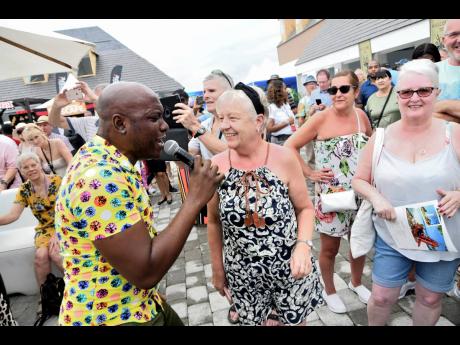 A member of Ashe Company performs for tourists after disembarking the ‘Marella Discovery 2’ cruise ship at the Port Royal Pier on in January this year. 