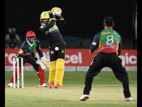 Jamaica Tallawahs’ Imran Khan (centre) is bowled and caught by St Kitts and Nevis Patriots’ Mohammed Hafeez while wicketkeeper Devon Thomas looks on during their Caribbean Premier League game at Sabina Park in Kingston on Thursday, September 19, 2019.