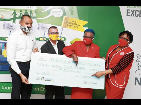 Masks for all: Donning branded masks are members of Nestle Jamaica and the Jamaica Red Cross. From left: Linton Johnson in Carlton Brown, Daniel Caron in Cheerios and Yvonne Clarke and Hope Monroe, both in Jamaica Red Cross.
