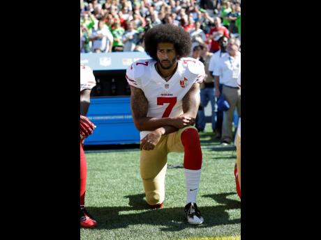 FILE
In this September 25, 2016 file photo, San Francisco 49ers’ Colin Kaepernick kneels during the national anthem before an NFL football game against the Seattle Seahawks, Sunday, September 25, 2016, in Seattle. 