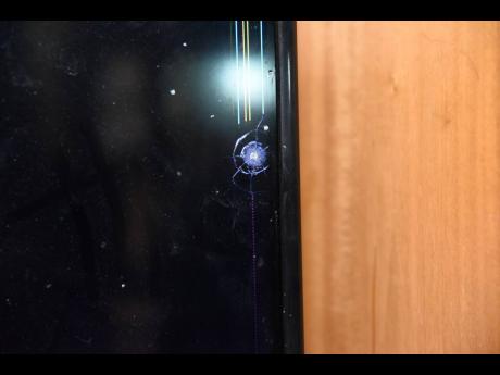 During a fatal shootout in Horizon Park, St Catherine, on June 12, a bullet pierced the window of a neighbour’s house damaging a whatnot and lodging in her television set.