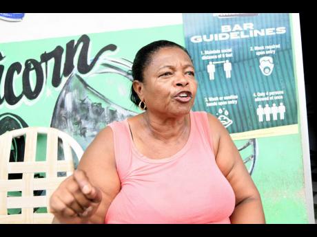 Rosalie Hamilton, councillor for the Rae 
Town division in 
Kingston Central, talks 
on Sunday about a truce brokered between rival gangsters. She was at 
her Gold Street office in downtown Kingston.
