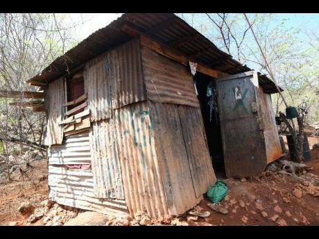 The dilapidated one-room shack at Black Street in Eleven Miles, Bull Bay, where Madgeline Carter lives with her family.