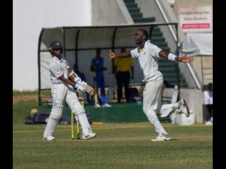 Fast bowler Marquino Mindley (right) celebrates after picking up the wicket of Barbados Pride wicketkeeper-batsman Shane Dowrich (left) for the Jamaica Scorpions during their Cricket West Indies Professional Cricket League Regional Four-Day Championship ma