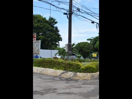 Dangling and downed cables on Jimmy Cliff Boulevard.