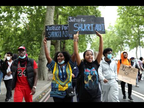 Protesters during a Justice for Shukri Abdi demonstration, to support the family in their pursuit of justice, in central London, yesterday, following on from a raft of Black Lives Matter protests across the world sparked by the recent death of a Black man,