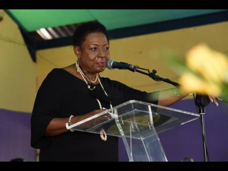 Minister of Culture, Gender, Entertainment and Sport, Olivia Grange, pays tribute to Bobby Digital .