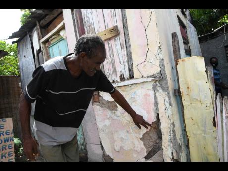 Nigel Townsend expressing concern over the structural soundness of his dwelling to The Gleaner on June 19. The house has been demolished by community members, who are now erecting a new home for Townsend. 