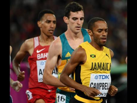 In this file photo from August 2017, Jamaica’s Kemoy Campbell (right) takes part in heat two of the men’s 5000m race at the World Athletics Championships in London, England.