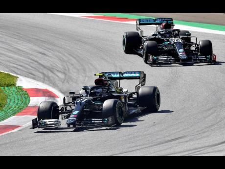 Finnish Mercedes driver Valtteri Bottas leads British teammate Lewis Hamilton during the Austrian Formula One Grand Prix at the Red Bull Ring racetrack in Spielberg, Austria, yesterday.