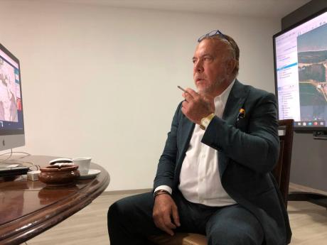 In this April 29, 2020 photo, Venezuelan shipping magnate Wilmer Ruperti smokes a cigarette during an interview in Caracas, Venezuela.