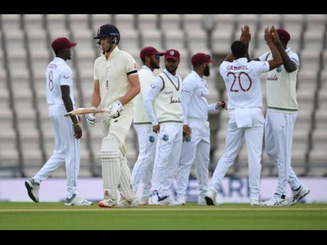 England’s Dom Sibley (second left) leaves the field after being dismissed by West Indies’ Shannon Gabriel (second right) during the first day of the first cricket Test match between England and West Indies, at the Ageas Bowl in Southampton, England, ye