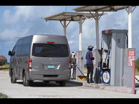 A vehicle being fuelled at the Fuel Deals Express depot in Kingston, on Thursday, July 9.