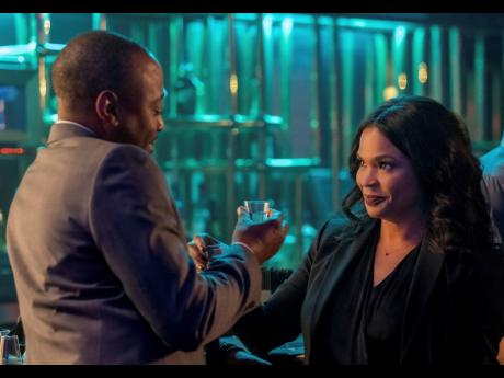 This image released by Netflix shows Nia Long (right) and Omar Epps in a scene from ‘Fatal Affair’.