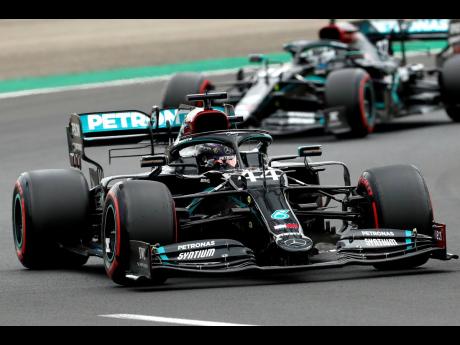 
Mercedes driver Lewis Hamilton leads his teammate Valtteri Bottas during the qualifying session for the Hungarian Formula One Grand Prix at the Hungaroring racetrack in Mogyorod, Hungary, yesterday.