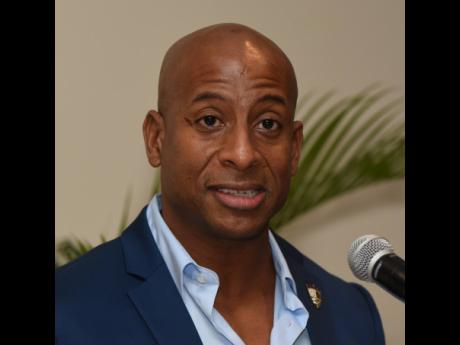 Omar Robinson, president of the Jamaica Hotel and Tourist Association, addresses journalists at a media briefing at The Jamaica Pegasus hotel on Tuesday.