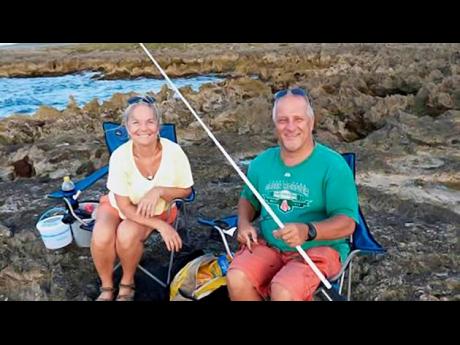 Teri and Harold Nichols fishing in Jamaica.