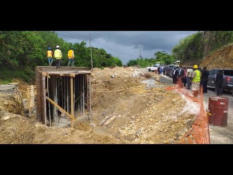 Prime Minister Andrew Holness, along with a delegation, views a section of the Portland leg of the South Coast Highway Project in Manchioneal.