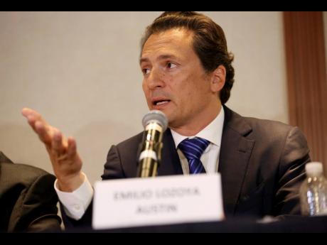 In this August 17, 2017 photo, Emilio Lozoya, former head of state-owned oil company Pemex, speaks at a press conference in Mexico City.