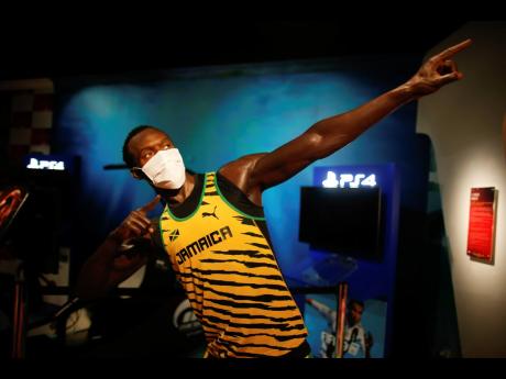 
In order to raise awareness against the spread of the coronavirus, a mask is placed on the wax figure of Jamaica’s Usain Bolt at Madame Tussauds attraction in Istanbul on Saturday, July 11.