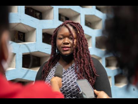 Sherine Virgo speaks with the media outside the Supreme Court in Kingston on Friday July 31, 2020, following the verdict in a case where her child was denied attending Kensington Primary School as a result of having dreadlocked hair in 2018. The court rule
