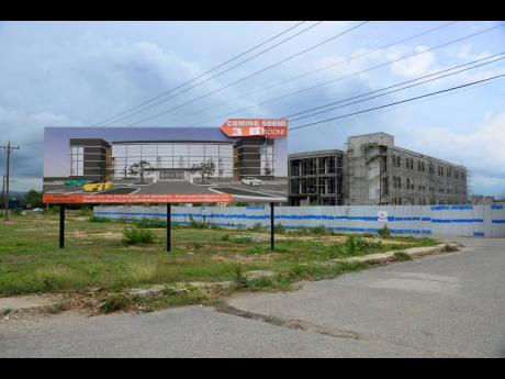 This photo taken on Monday shows a building under construction which is expected to host a business processing outsourcing offices on Municipal Road, Portmore, St Catherine.
