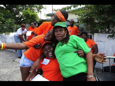 People’s National Party and Jamaica Labour Party supporters frolic on the road during the March 2012 local government elections. Concerns over COVID-19 infections have put the issue of tougher gathering protocols on the national agenda.