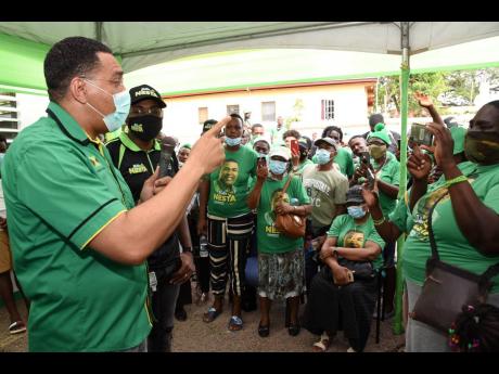 Ian Allen/Photographer
Prime Minister Andrew Holness addresses Jamaica Labour Party supporters who turned out for the opening of the Clarendon North Central constituency office in Chapelton.