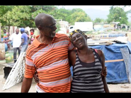 Colin Fagan interacts with a constituent during a walk-through of a community in St Catherine South East on August 4.