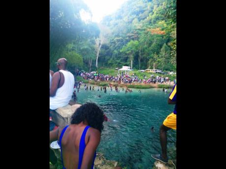A section of the crowd at Spanish Bridge in St Mary on Sunday, August 9. The leisure area was ordered closed, effective August 14, by Local Government Minister Desmond McKenzie.