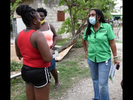 Natalie Campbell-Rodriques, Jamaica Labour Party candidate for St Catherine North Central, meets with residents in Caswell Farm, Spanish Town, during a campaign trail.