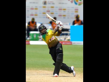 Asif Ali of Jamaica Tallawahs hits a 6 during the Hero Caribbean Premier League match between Jamaica Tallawahs  and  St Lucia Zouks at Brian Lara Cricket Academy yesterday in Tarouba, Trinidad and Tobago. Ali scored 47 for the Tallawahs who won by 5 wicke