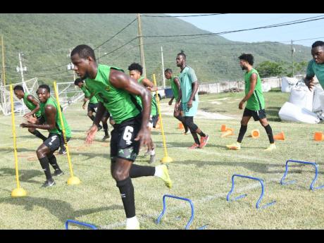 Members of Jamaica’s Reggae Boyz team go through their paces during a training session at the UWI/JFF Captain Burrell Centre of Excellence on Tuesday, August 27, 2019.