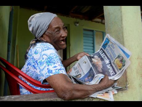 Eva Thomas, 94, was seen reading a copy of The Sunday Gleaner on her veranda in Bannister, Old Harbour, on August 24. Thomas, who will be 95 on Sunday, August 30, said that COVID-19 will pass just like chikungunya and other disease outbreaks.