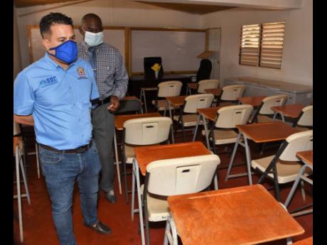 Minister without Portfolio Matthew Samuda (left) is shown the cafeteria of the New Broughton Sunset Rehabilitation Adult Correctional Centre by Superintendent A. Devon Hall on May 2, 2020. Samuda toured the facility to assess coronavirus health and safety 