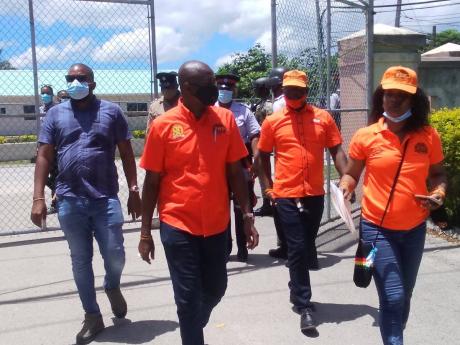 People’s National Party incumbent (second left) Ian Hayles walking with supporters to the nomination centre in Hanover Western to secure his place on the ballot on August 18.