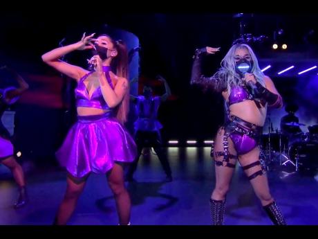 Ariana Grande (left} and Lady Gaga perform ‘Rain On Me’ during the MTV Video Music Awards.